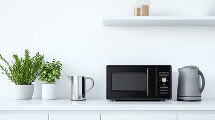 A minimalist kitchen in cool white tones with a white countertop, a black microwave, a gray kettle, a silver mug, and a green plant, featuring a clean and serene atmosphere