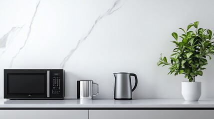 A minimalist kitchen in cool white tones with a white countertop, a black microwave, a gray kettle, a silver mug, and a green plant, featuring a clean and serene atmosphere