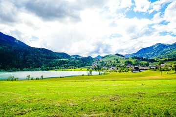 Landscape near Thiersee in Tyrol. Nature by the lake with meadows and mountains.
