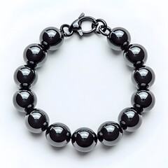 Obraz premium Sleek and Sophisticated Black Metallic Bracelet on Plain Background