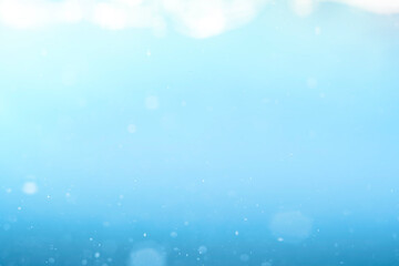 Empty background with bubbles in slight blur at high magnification. Background with close-up of drinking water in soft focus.