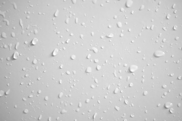 Water drops on white wall background texture