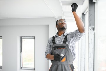 hvac worker install ducted pipe system for ventilation and air conditioning. copy space