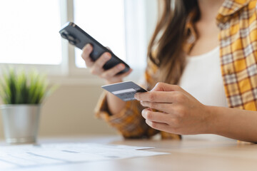 Digital Finance at Fingertips: Close-Up Hands Seamlessly Handling Bills and Smartphone for...