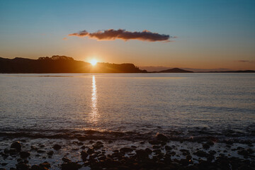Shoreline of the Firth of Thames at sunset at Orere Point, Auckland, New Zealand.