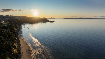 Shoreline of the Firth of Thames at sunset at Orere Point, Auckland, New Zealand.
