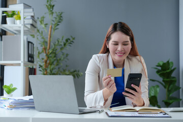 Asian businesswoman hands holding smartphone shopping online with a credit card. Online Payment. Online shopping