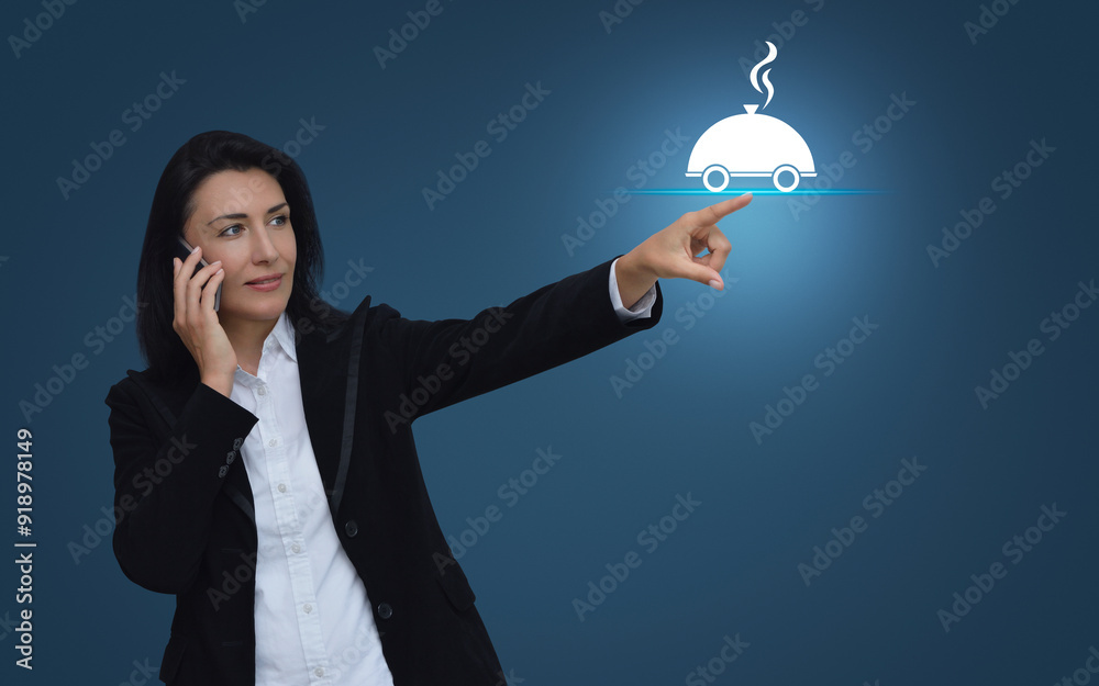 Wall mural businesswoman talking on her cell phone and pointing finger to restaurant cloche flat icon over ligh