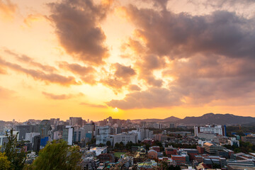 Gold sunset of Seoul cityscapes with high rise office buildings and skyscrapers in Seoul city, Republic of Korea in winter blue sky and cloud