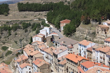 Fototapeta premium Ares del Maestre, a medieval village in the Province of Castellón, Spain, with a stone castle in ruins on a hilltop