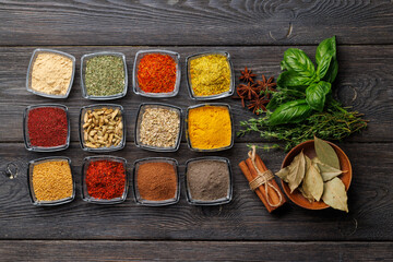A vibrant assortment of various spices and herbs displayed together