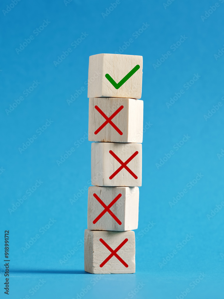 Wall mural stack of wooden cubes showing the concept of right and wrong choices