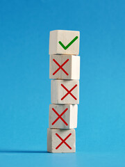 Stack of wooden cubes showing the concept of right and wrong choices