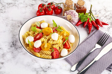 Italian pasta with mozzarella and tomato