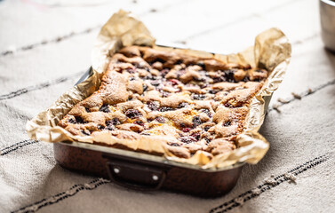 Fresh and hot blackberry cake made of blackberries, flour and eggs. Vegan fruit sponge cake