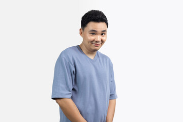 Portrait of man sly smile with blue shirt against white background