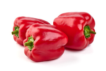 Red ripe bellpeppers, isolated on white background.