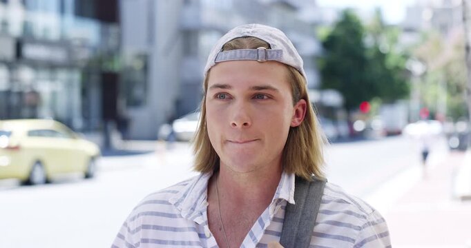 Face, man and interview in street, conversation and communication for travel destination. Portrait, person with question on news in city and talk, video call for holiday or vacation on tv broadcast