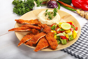 Slices pork schnitzel with vegetables