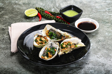 Open half oysters with green onion