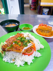 Vietnamese broken rice with grilled pork chop, which is charred, juicy, luxuriant with flavor, is a favourite dish of many people
