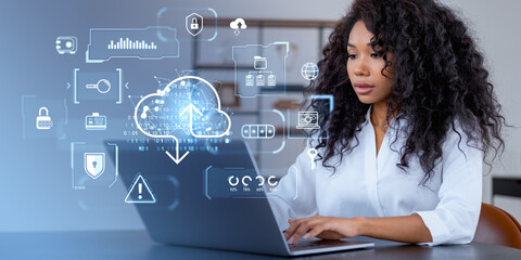 African woman typing in laptop, glowing cloud, data storage and security