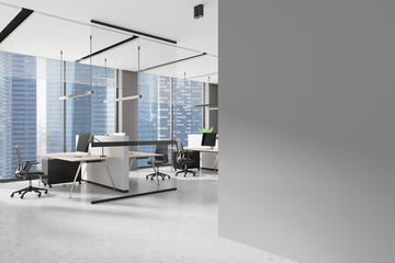 Light coworking interior with pc computers on desks in row, window. Mockup wall