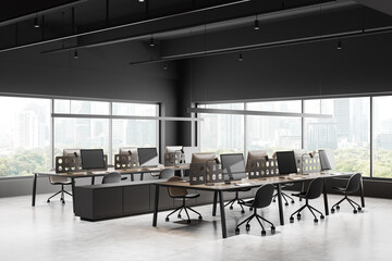 Modern office workplace interior with pc monitors in row, panoramic window