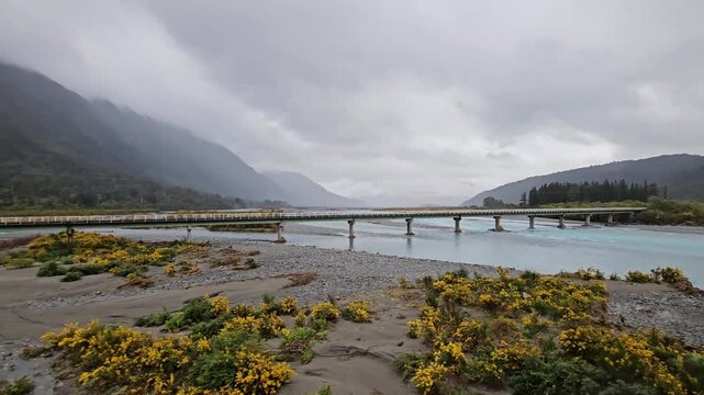 4K, Tranzalpine train journey New Zealand, glacier glacial braided river, mountains clouds and rain, tourist tourism travel journey destination
