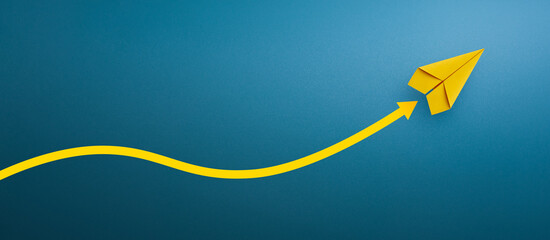 Yellow paper plane and yellow arrow, Business success. copy space