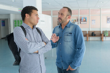 student and professor having casual conversation