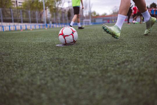 Soccer players playing match on field