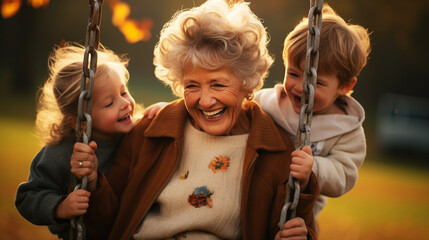 kids sitting in swinging hanging chair with grandparent