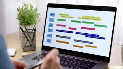 Calendar with scheduled dates and events on the laptop screen. The concept of reminding meetings and plans.