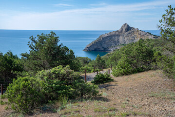 View of Cape Kapchik from the juniper grove. Golitsyn trail, Novy Svet settlement, Crimea