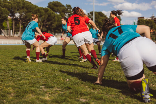 Rugby teams playing match on sports field