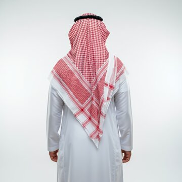 Back view of an Arab man in thobe standing on white isolated background