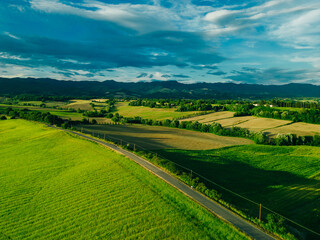 Beautiful landscape, spring nature. Rural landscape in summer. View of sunny fields at daylight