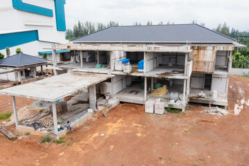 Aerial top view of Under construction residential new house with Concreate Block or lightweight brick, Exterior view of new Modern house under construction, Modern Villa Design Projects.