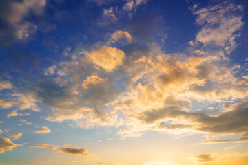 Dramatic cloudy sky at sunset or sunrise.