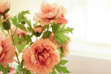 bouquet of fabric old rose color flower in vintage style with copy space , selective focus