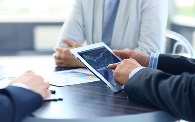 businessman holding digital tablet in office