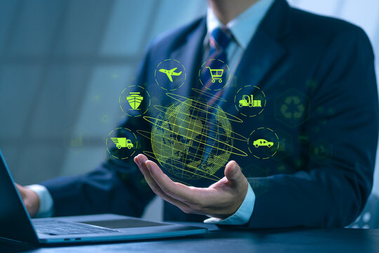 Businessman using computer with icons about green transportation, eco-friendly transportation and eco-friendly transportation industry analysis.