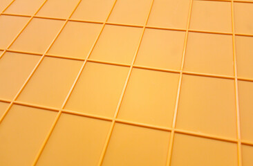 yellow plastic tile background, closeup of photo, elevated top view