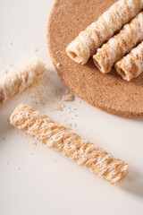 Crispy and delicious coconut crispy egg roll snack close up on white background
