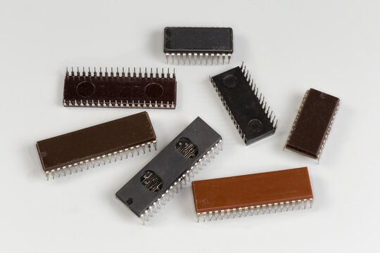 Different integrated circuits in plastic wide DIP packages