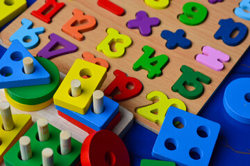 Set of different children's toys on a colored background top view. A place to insert text, minimalism. Baby background.