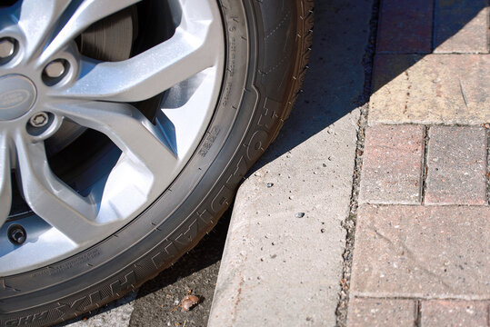 Minsk, Belarus. Aug 11, 2024. Car tire NEXEN Roadian HTX  touching curb when finish parking. Tire contact with curb, wearing down of tire sidewalls and potentially damaging the curb.