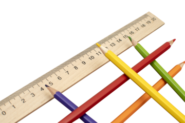 Colored pencils and school wooden measuring ruler isolated