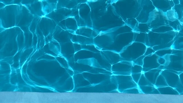 Swimming pool blue water abstract background texture.Summer vacation or relax concept,4k